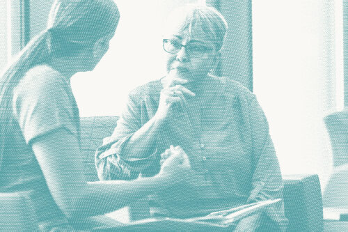an older woman speaks with her doctor