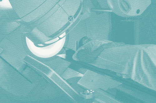 a woman gets radiation for breast cancer; she lies down with the machine overhead